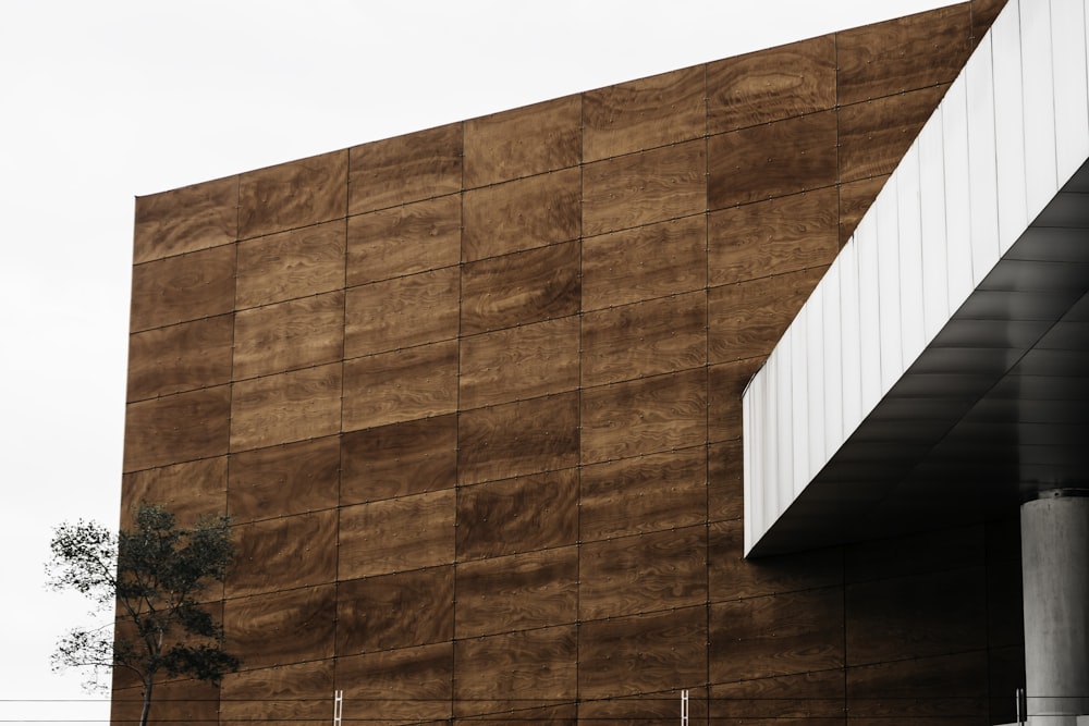 low-angle photography of brown and white building