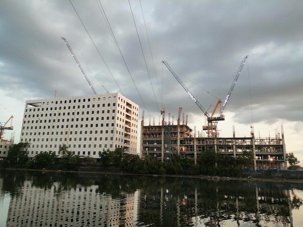 beige highrise building near body of water