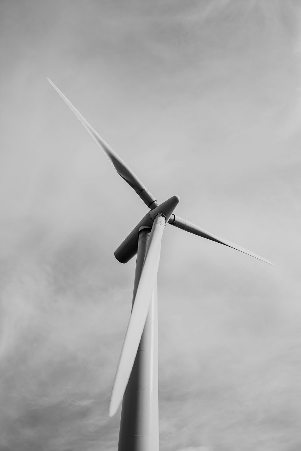 low-angle grayscale photography of a windmill
