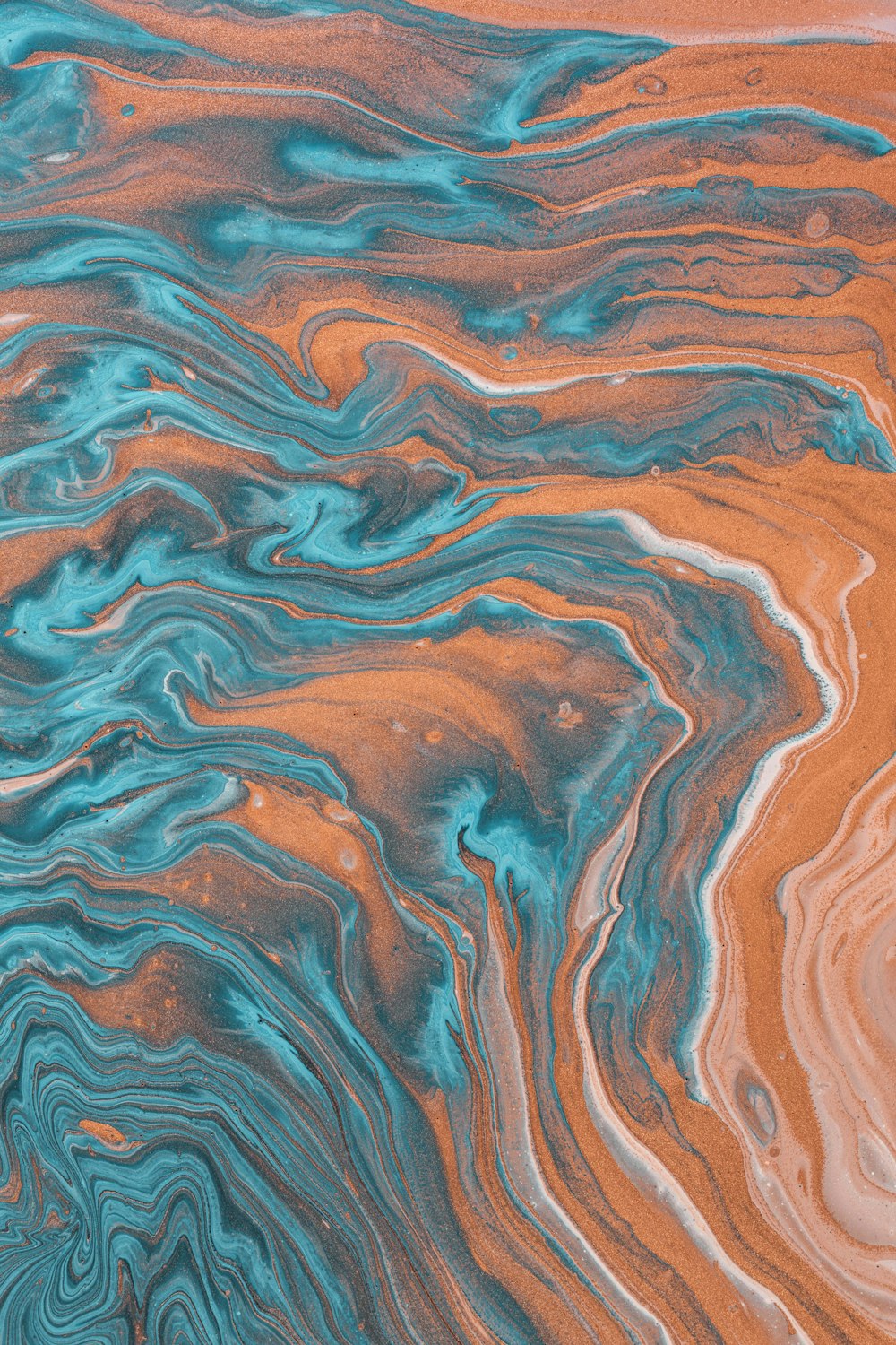 a close up of a blue and orange liquid