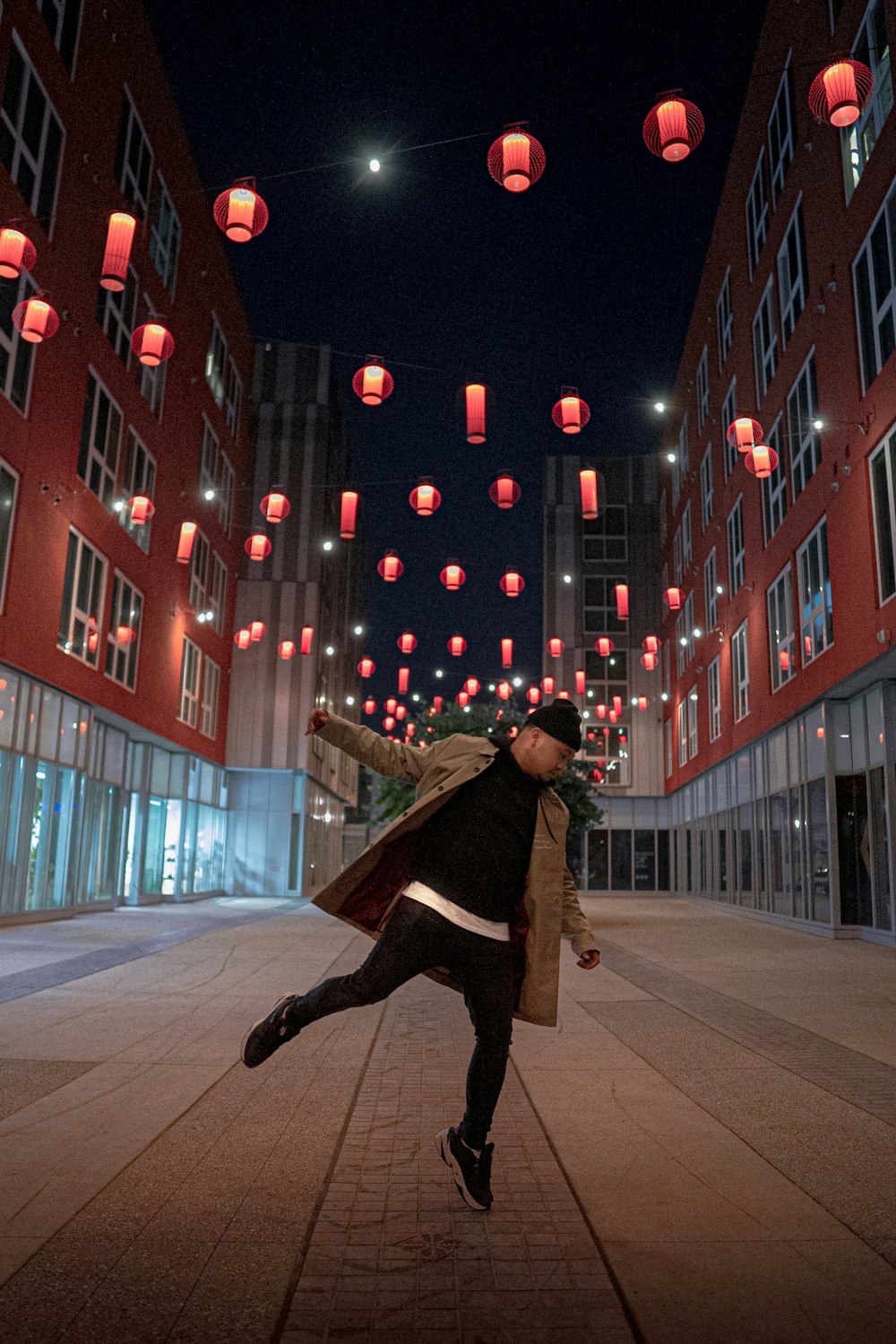 man wearing brown coat during nighttime