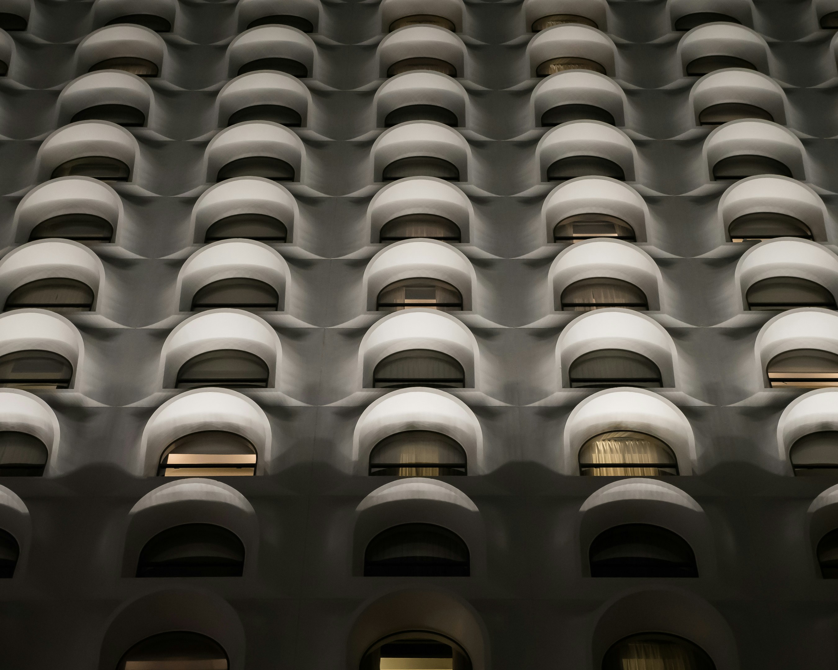 low-angle photo of white high rise building