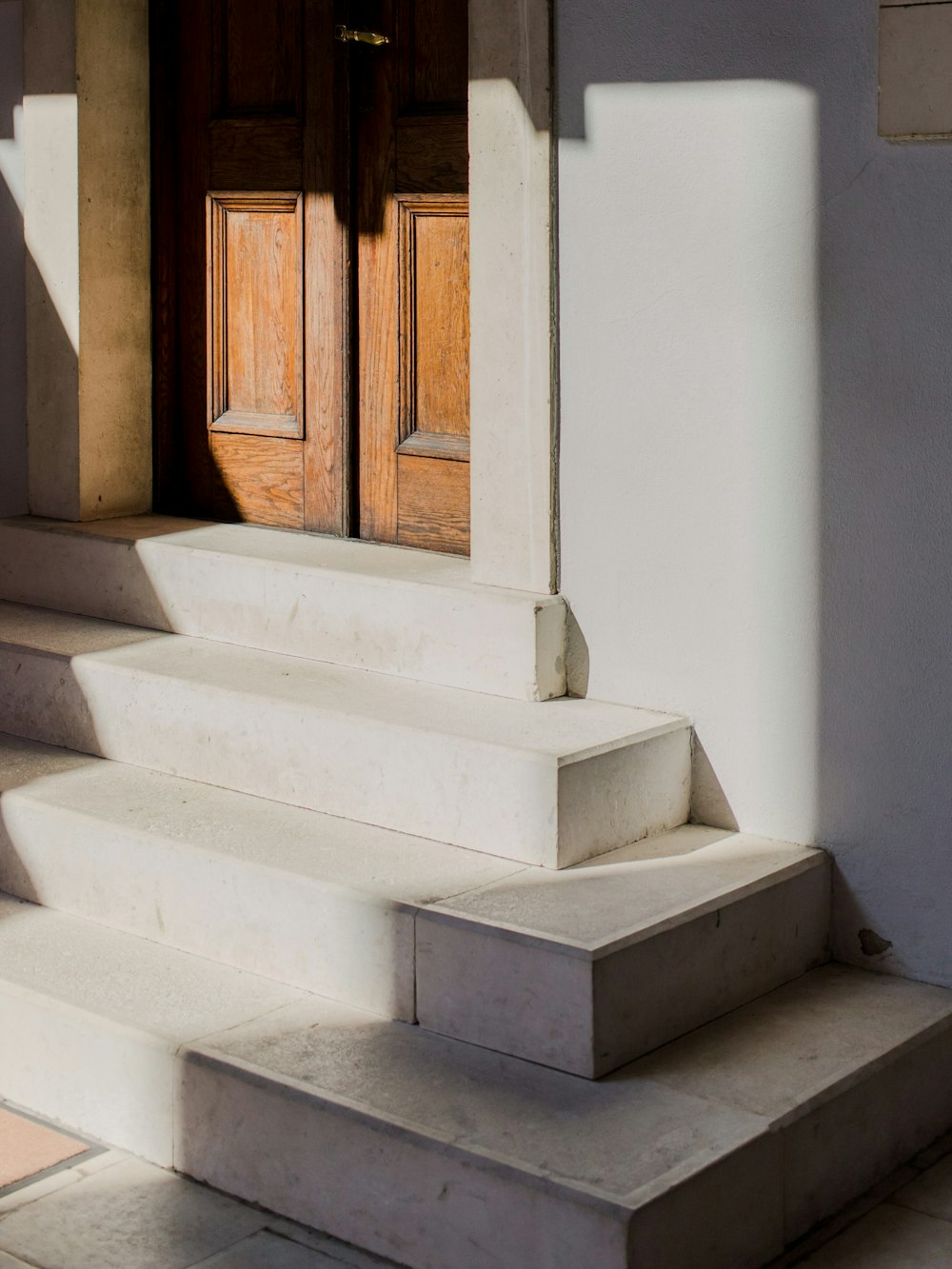 a close up of a set of stairs with a door
