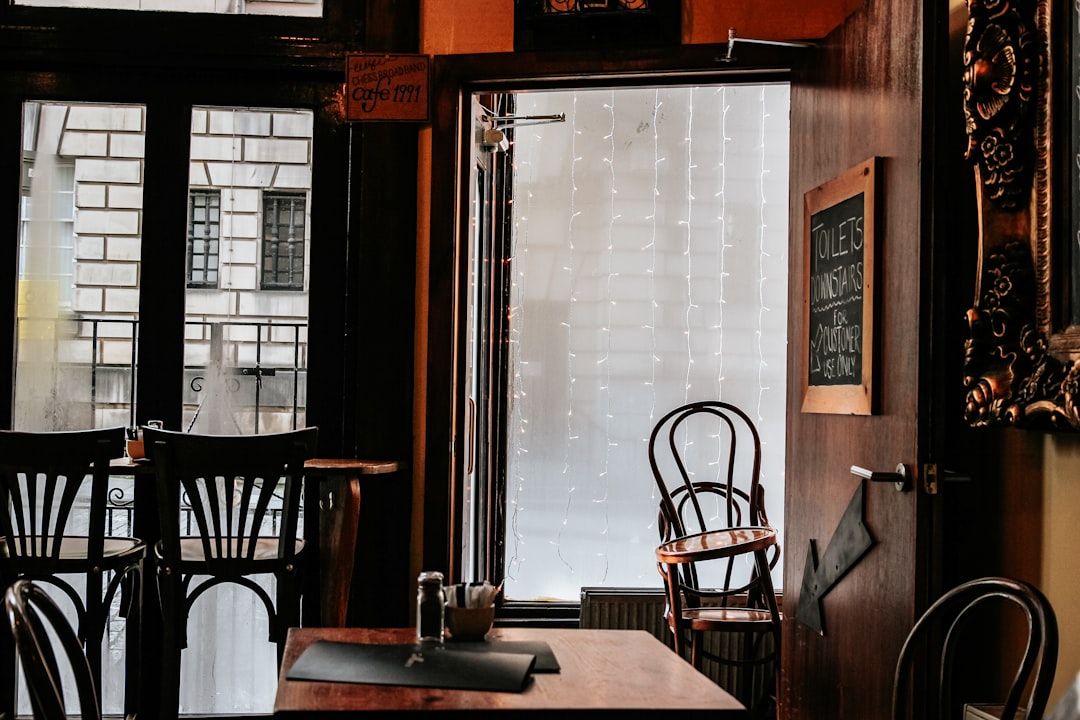 brown wooden chairs and table in room