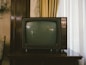 turned-off gray CRT TV on table