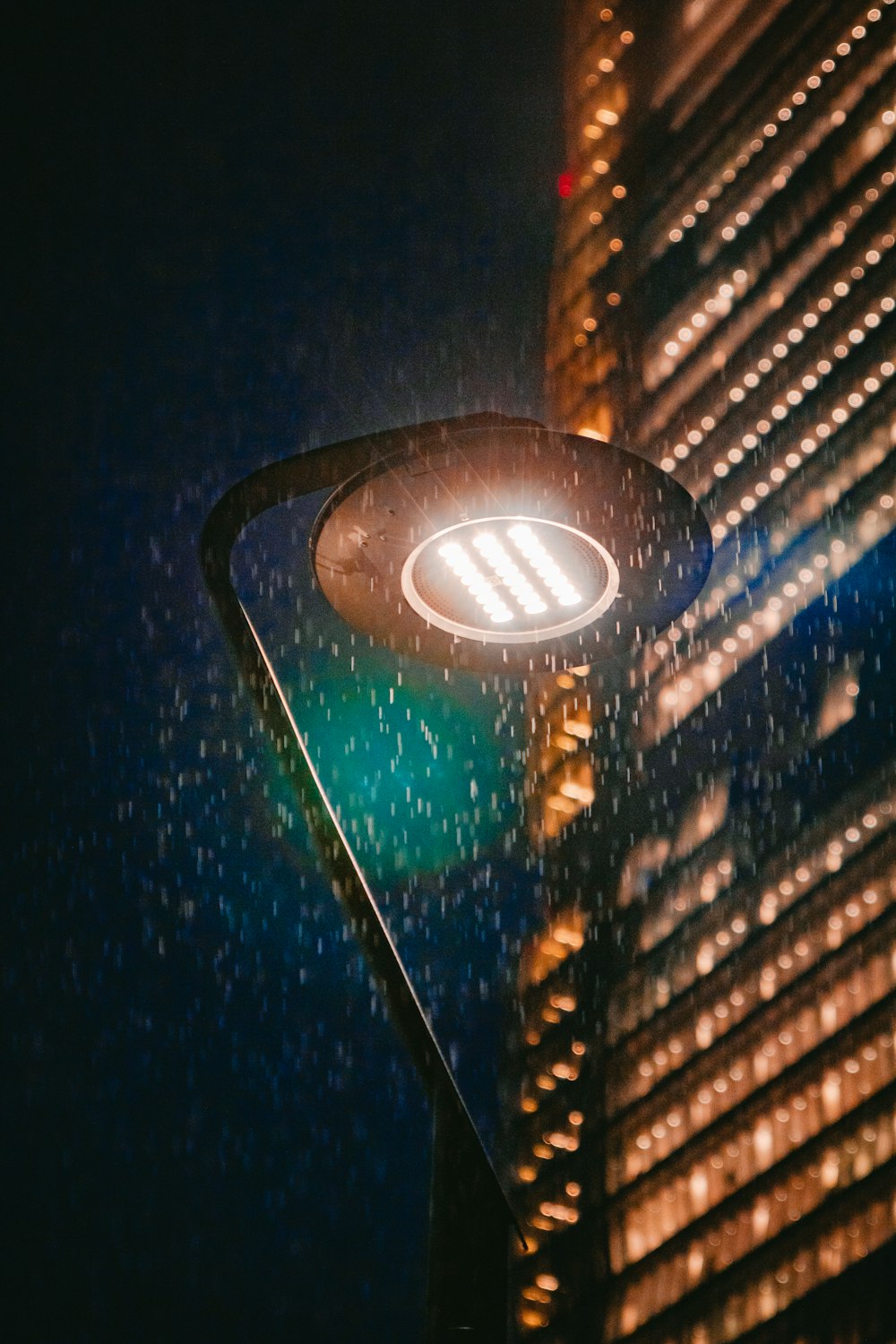 a traffic light with a building in the background