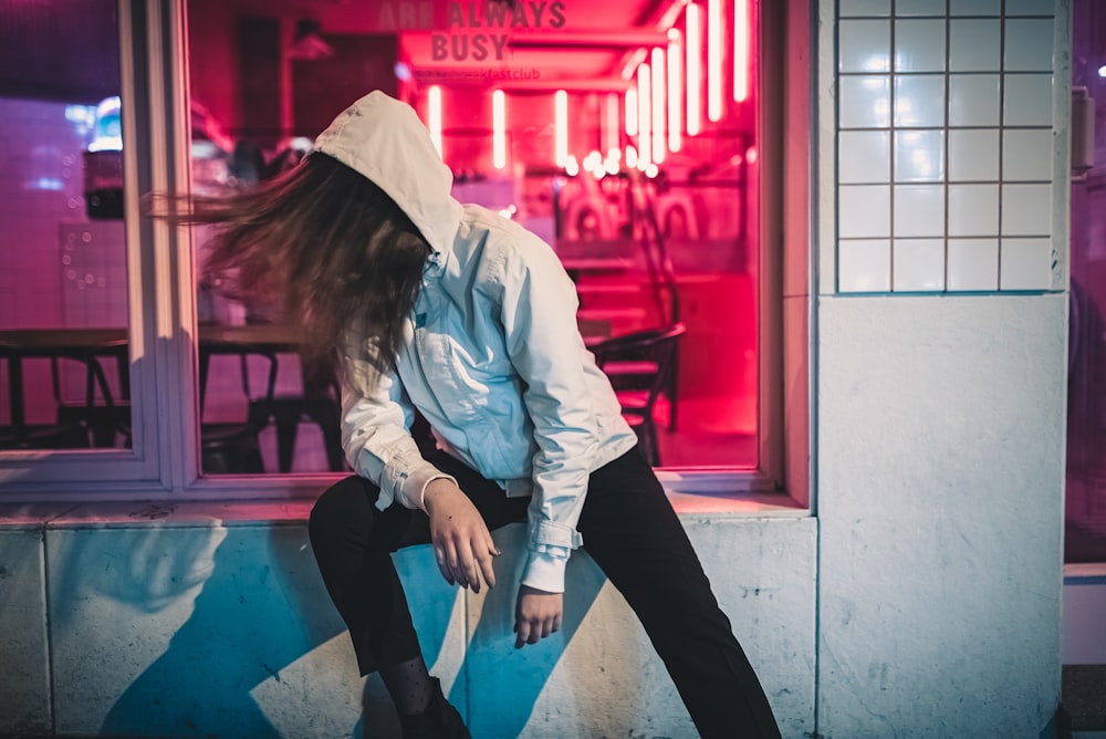 woman sitting in window