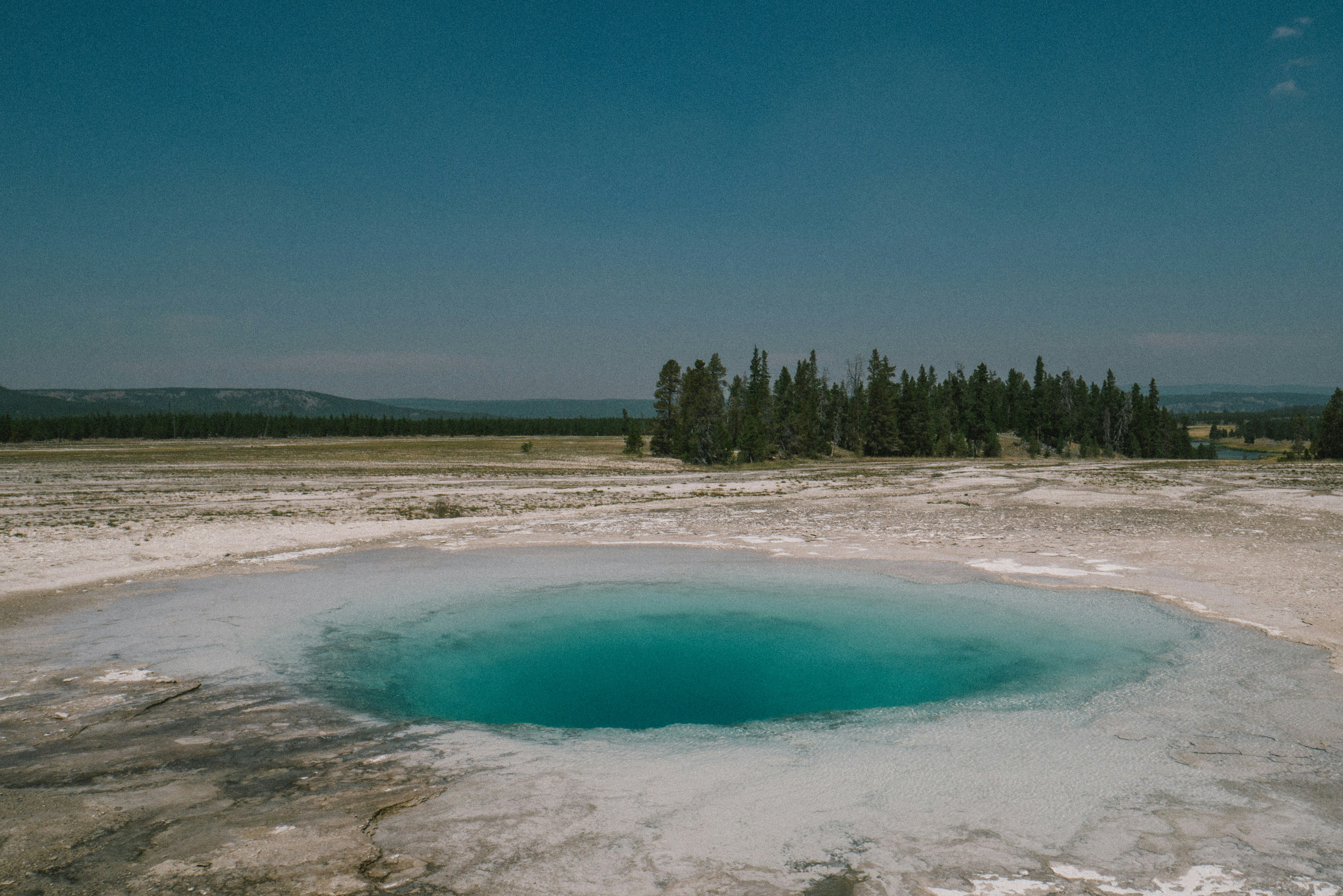 Blue hot spring geyser in Yellowstone National Park.