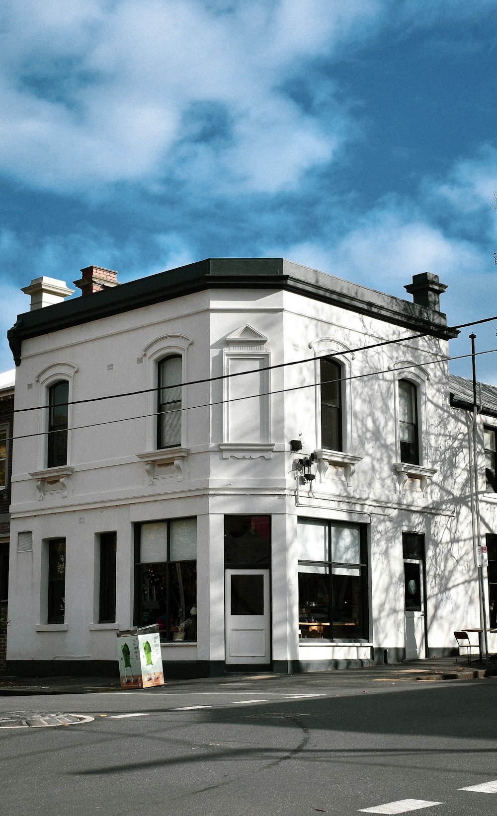 view photography of white and black concrete building during daytime