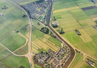 aerial photograph of village eside river