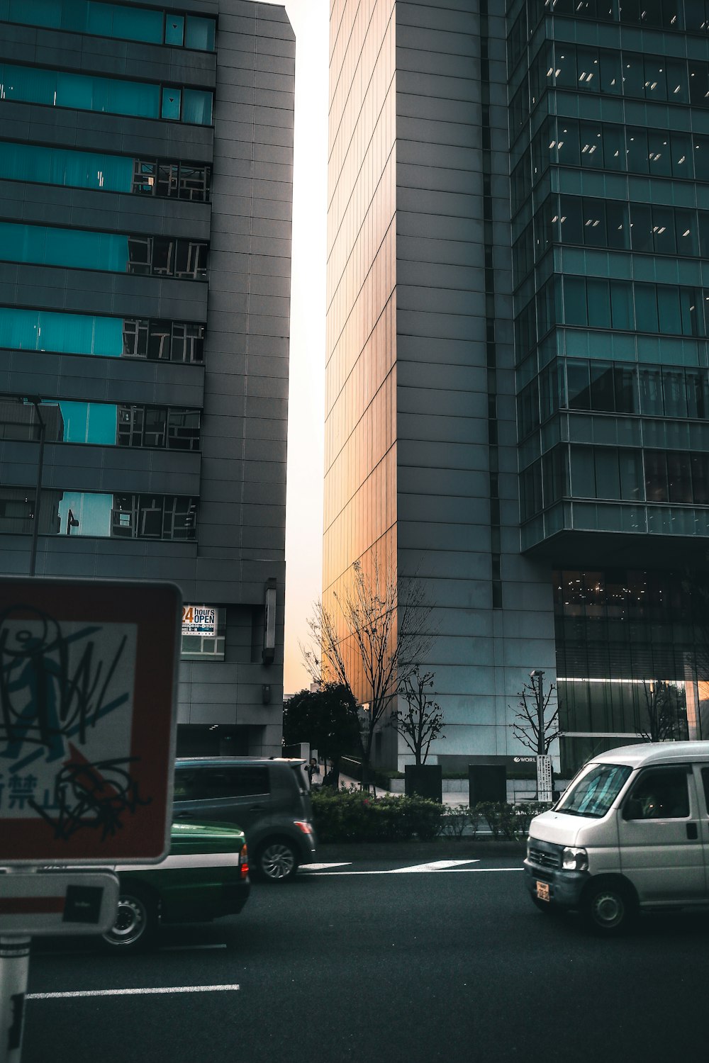 white car parked beside white concrete building during daytime