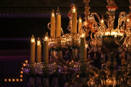 Close-up of a luxurious chandelier casting warm light in a modern home.
