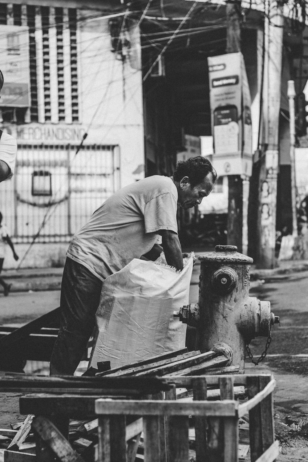 man holding white sack