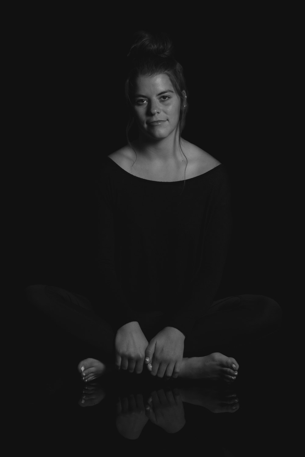 grayscale photo of woman wearing leggings and blouse