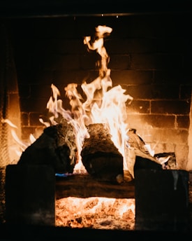 A cozy family gathering around a warm fireplace.