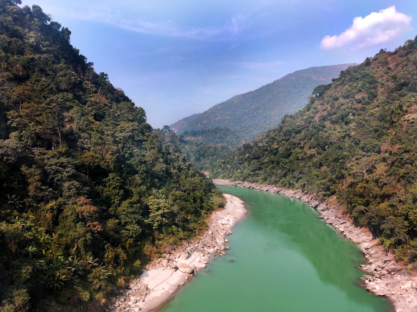 The jade green Teesta leaving its forested gorge at Sevoke, seen from the Coronation Bridge, white sand along both banks