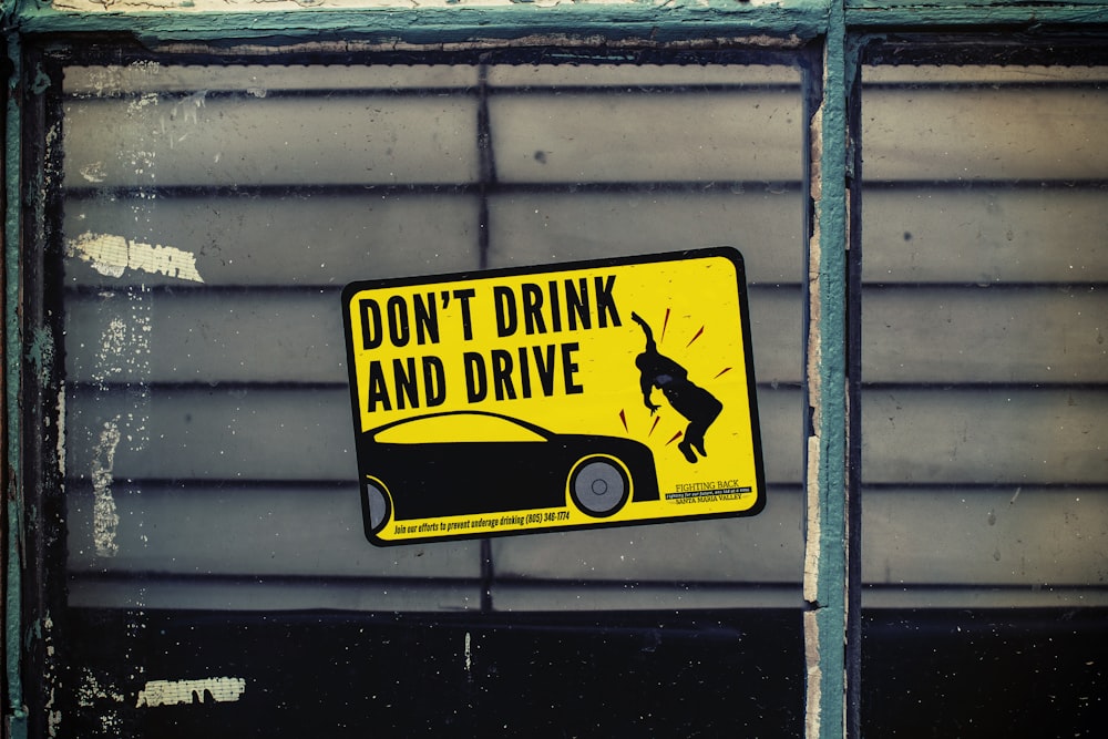 Don't Drink and Drive poster on glass panel