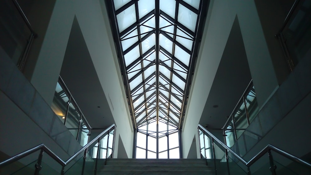low-angle photograph of building interior with sunroof