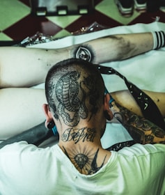 man doing tattoo