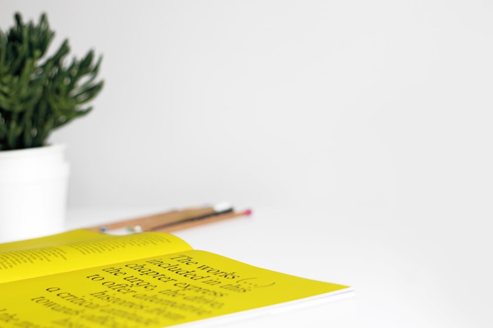 yellow printer paper on table