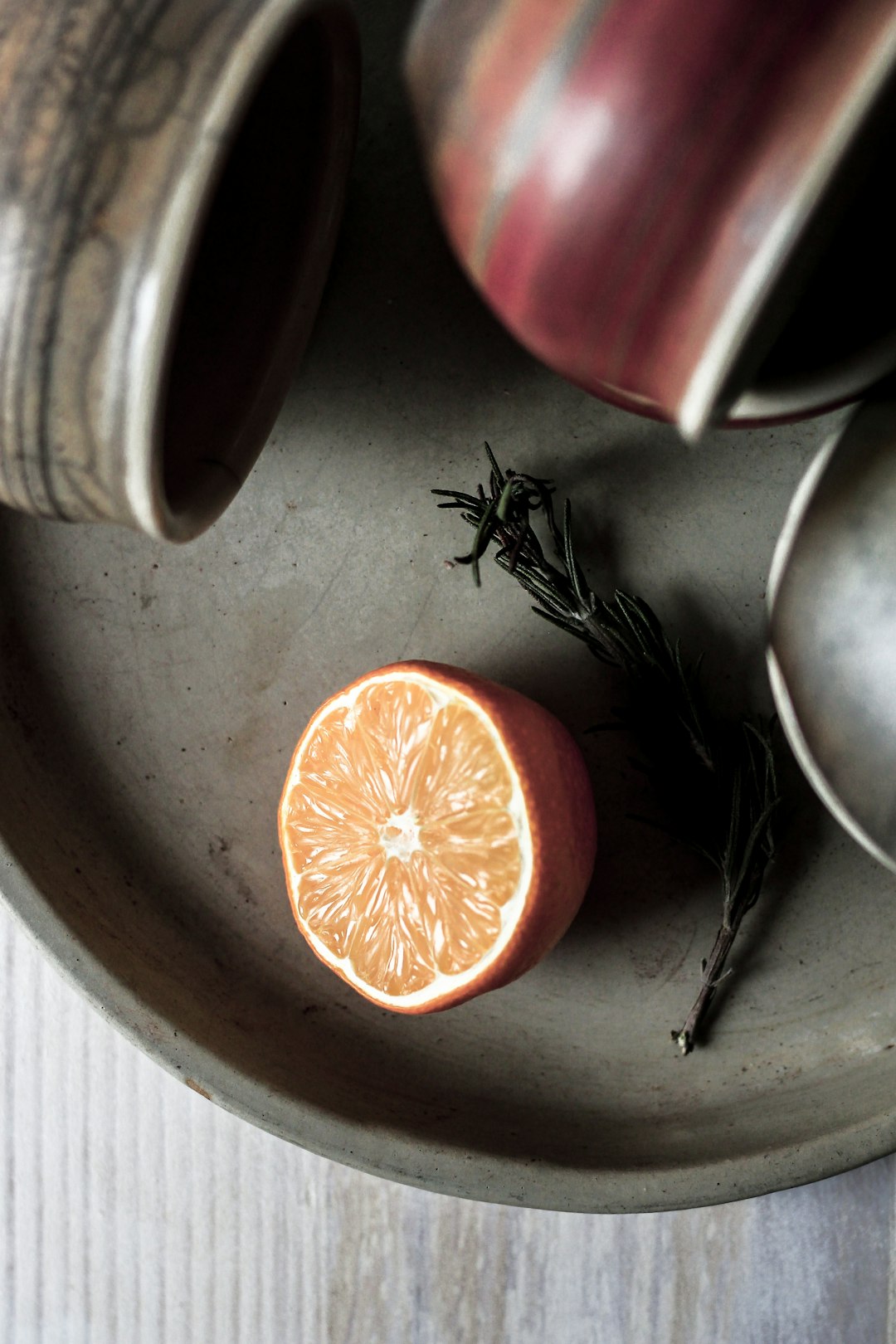 lemon slice on gray tray