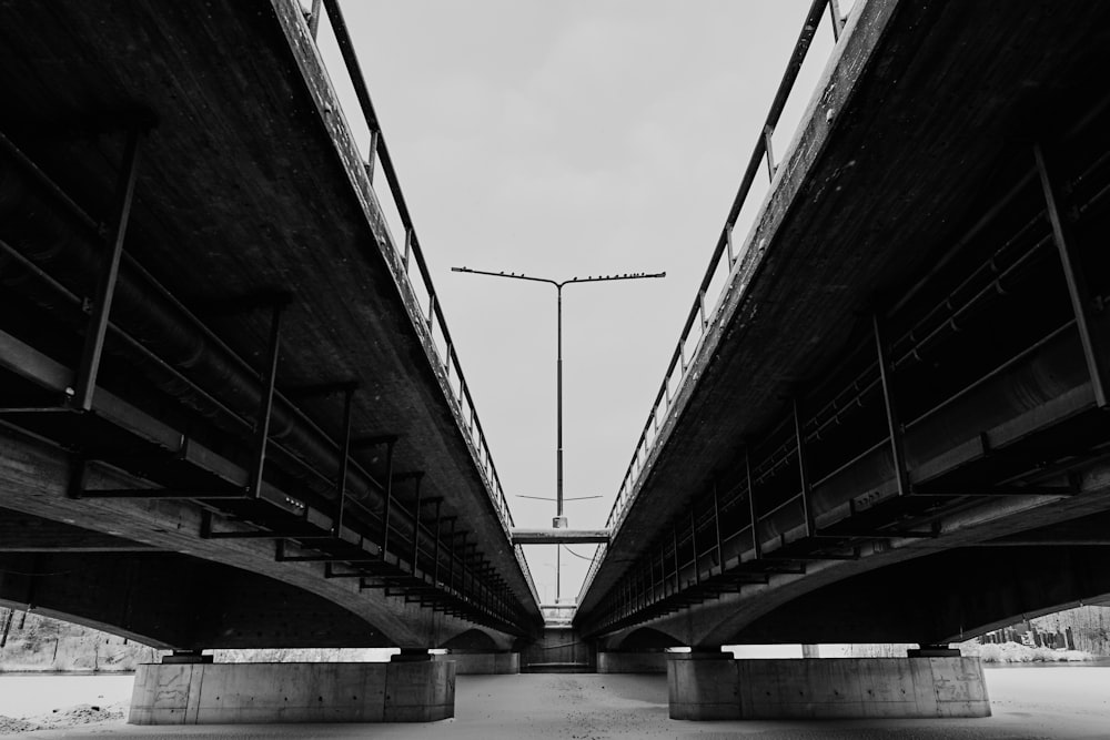 a black and white photo of a bridge