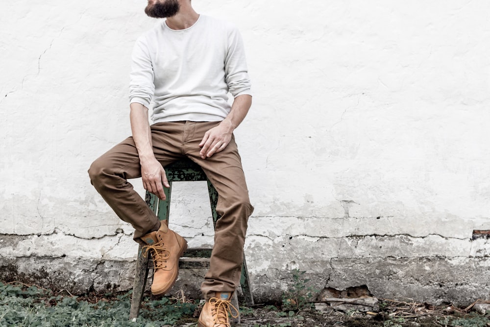 man sitting on stool