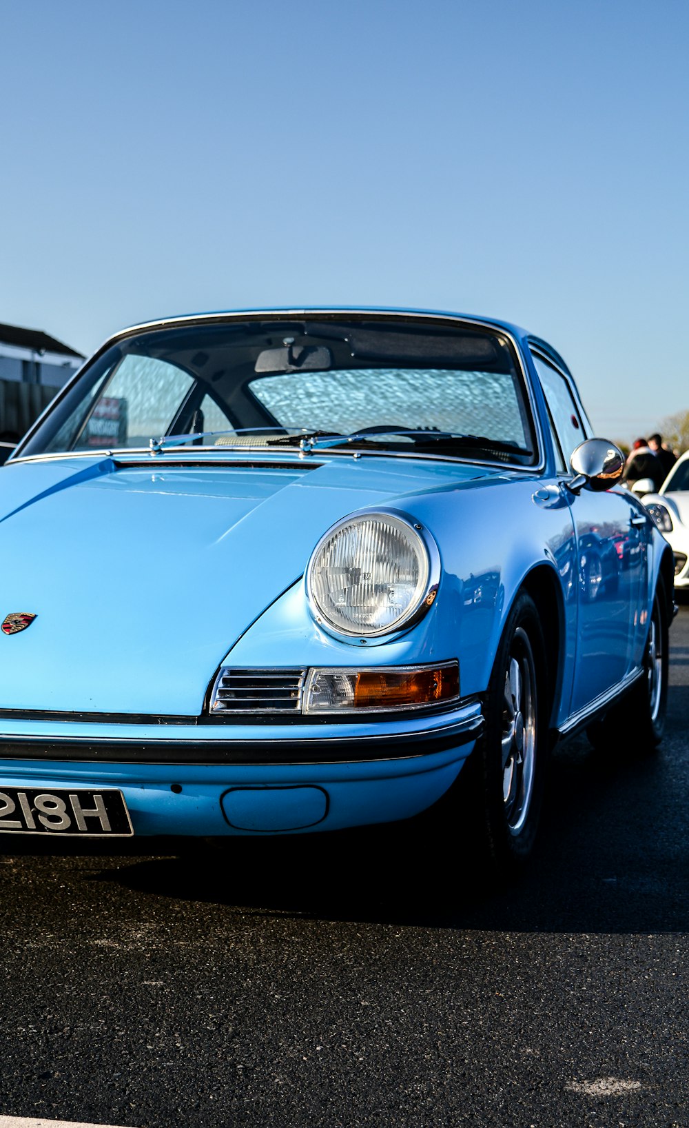 blue car parked near cars