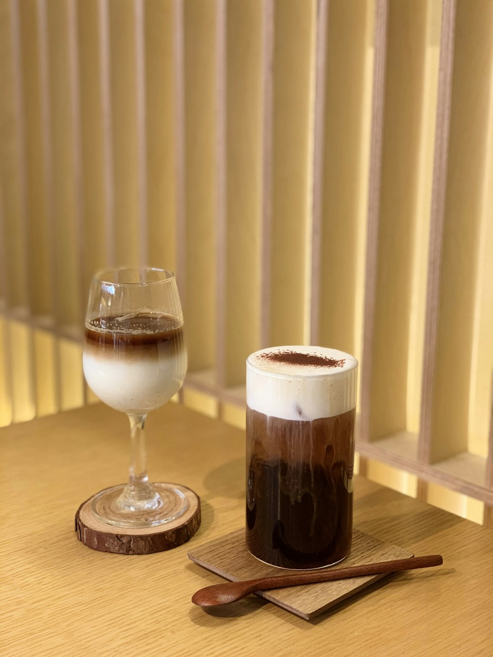 full clear wine glass on brown wooden table