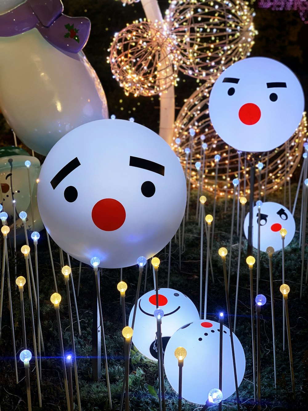 turned-on white snowman christmas lamp post