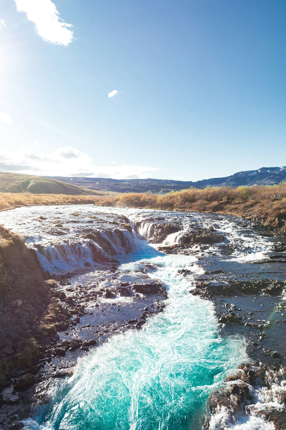 waterfalls and river during daytime