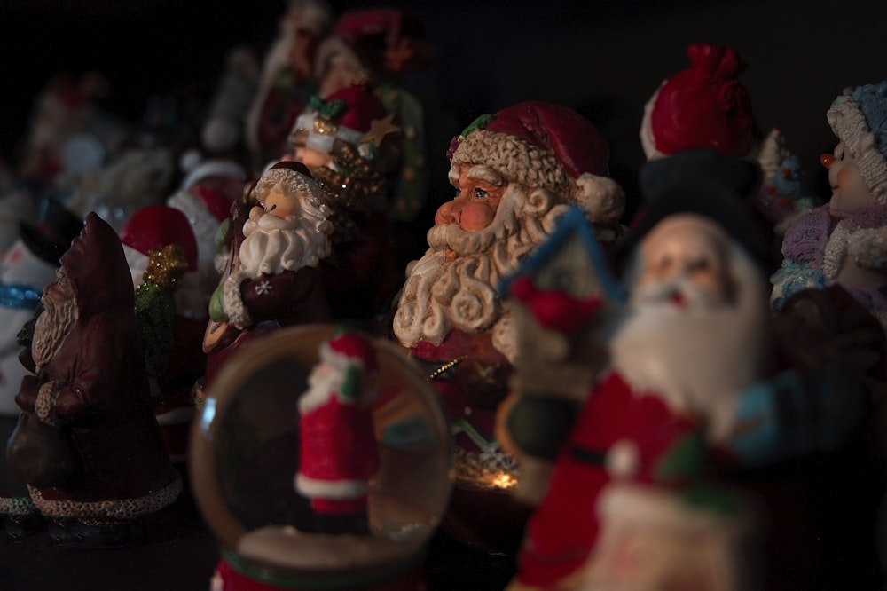 selective focus photography of Santa Claus figure lot