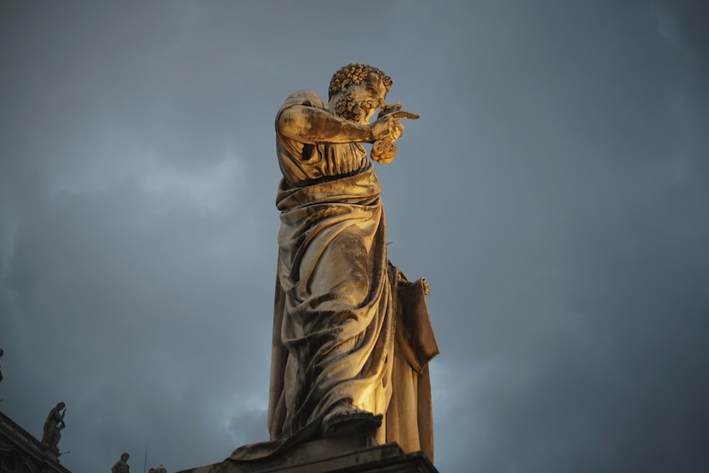 standing man statue during day