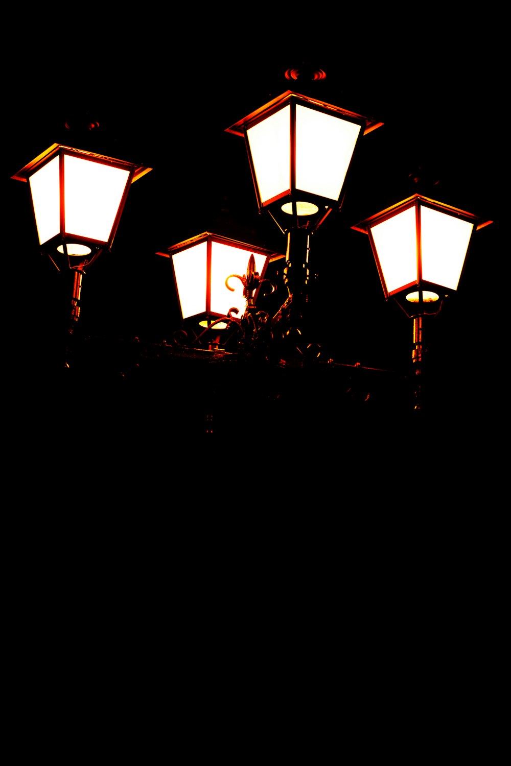 turned-on street lamps