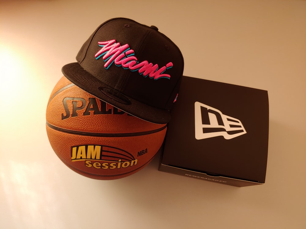 black Miami fitted cap on basketball