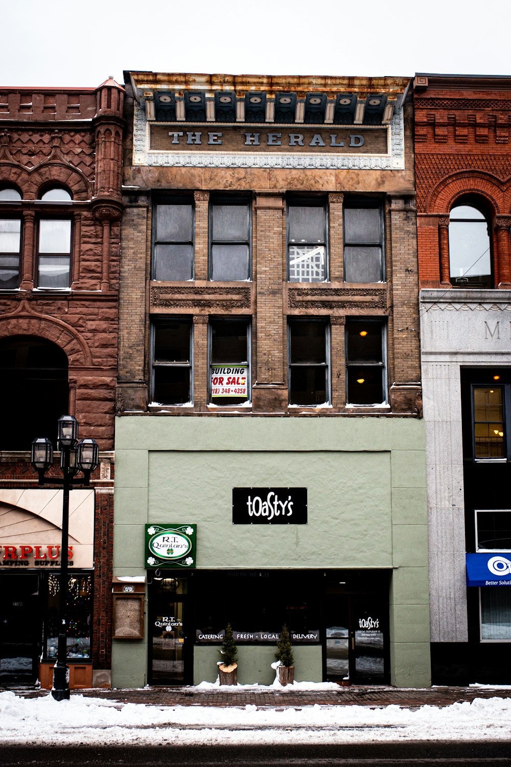 people sitting outside building