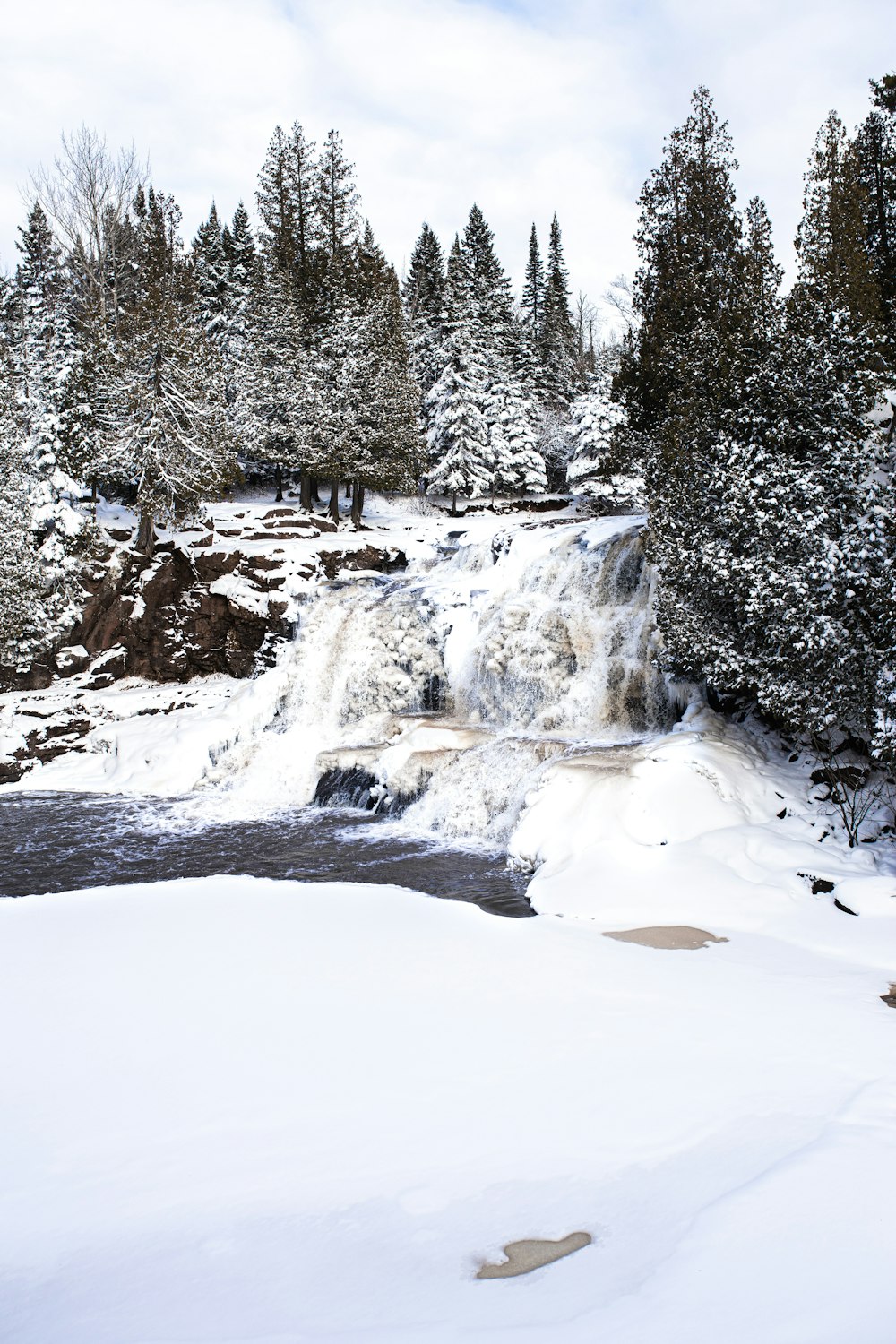 waterfalls between trees