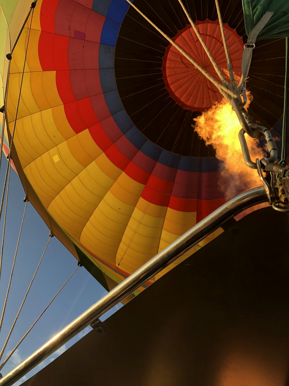 a large colorful hot air balloon being inflated
