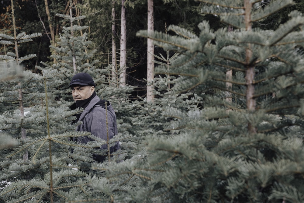 man standing in forest