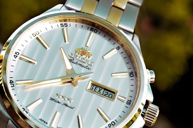 round silver-colored analog watch