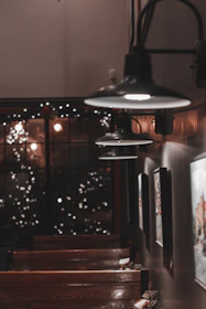 Warm, inviting interior of saborfuego with rustic decor and glowing lights.