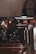 Warmly lit interior of Vamilia with rustic wooden tables and glowing pendant lights.