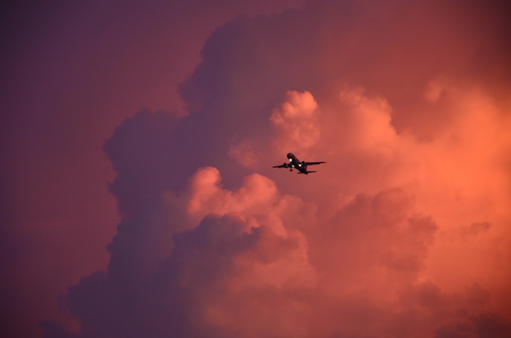 airplane near clouds