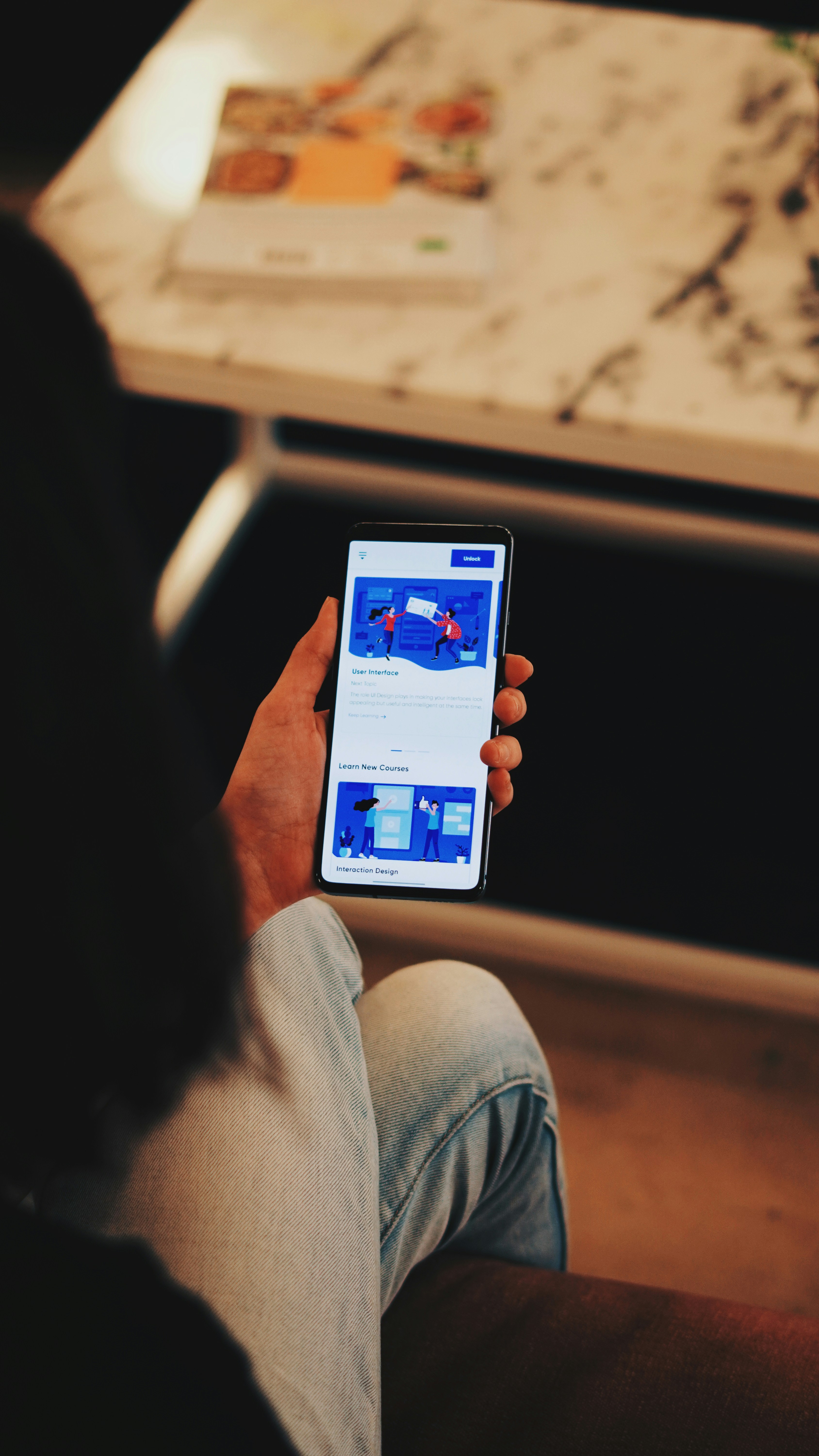 selective focus photography of person holding smartphone