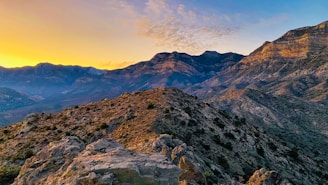 A breathtaking landscape photograph showcasing mountains and a sunset.
