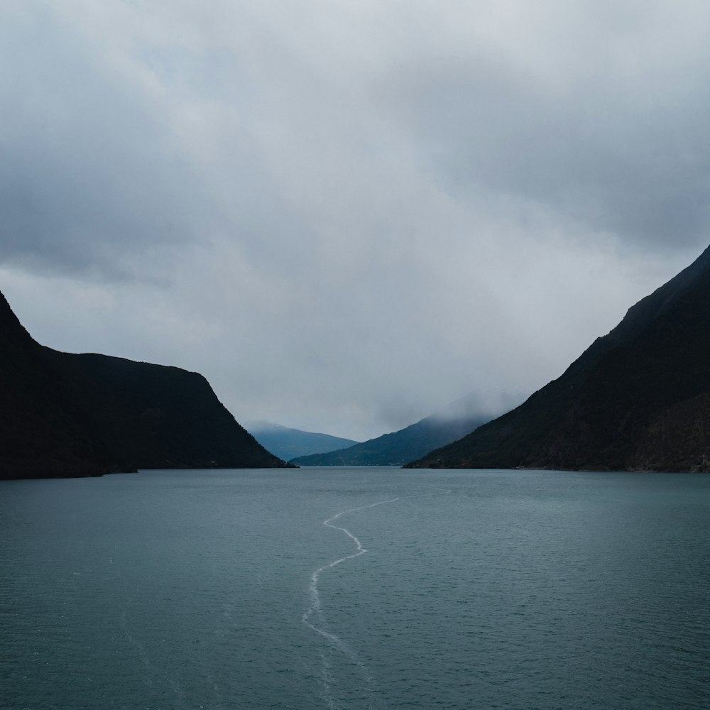 ocean surrounded with mountain