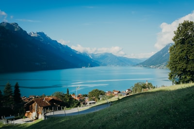 a scenic view of a lake surrounded by mountains