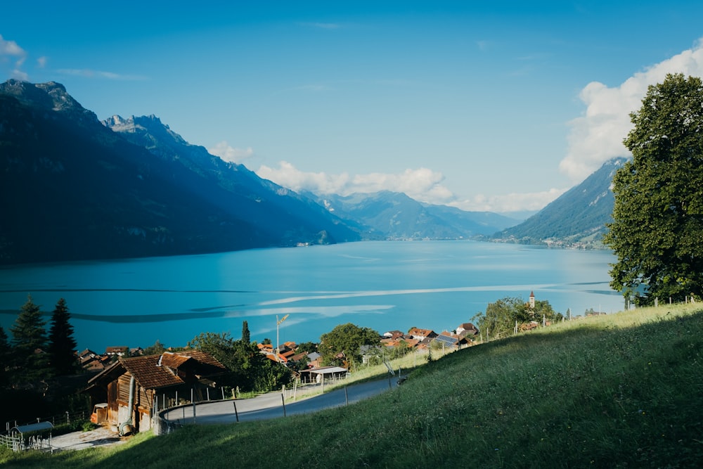 a scenic view of a lake surrounded by mountains