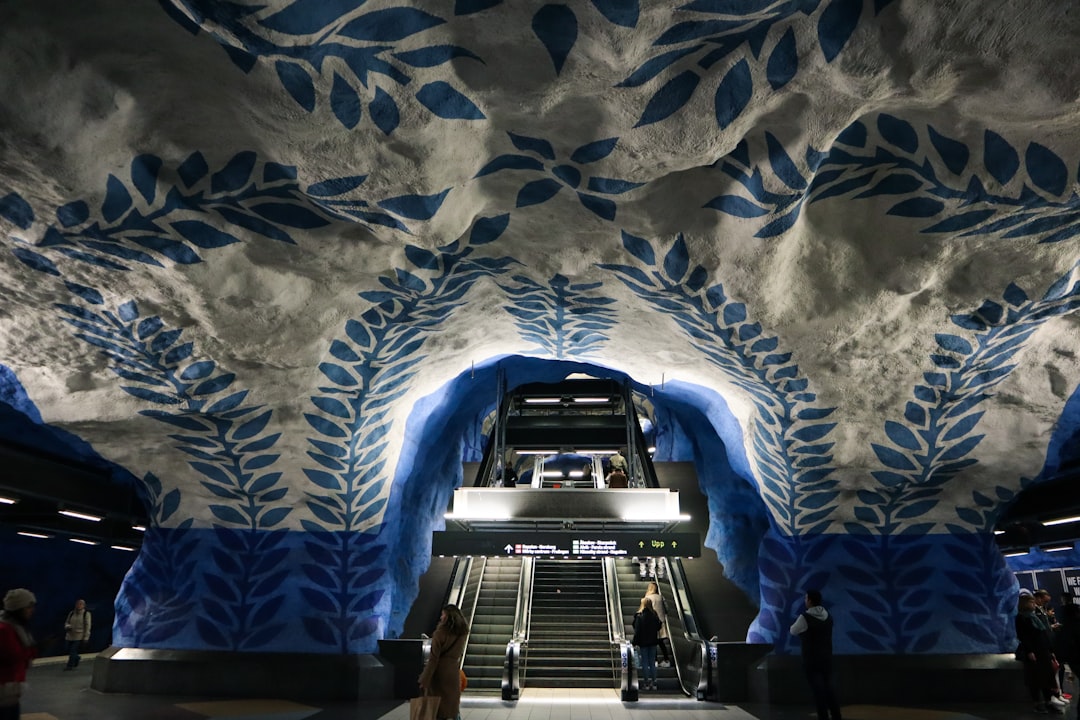 people walking near escalators