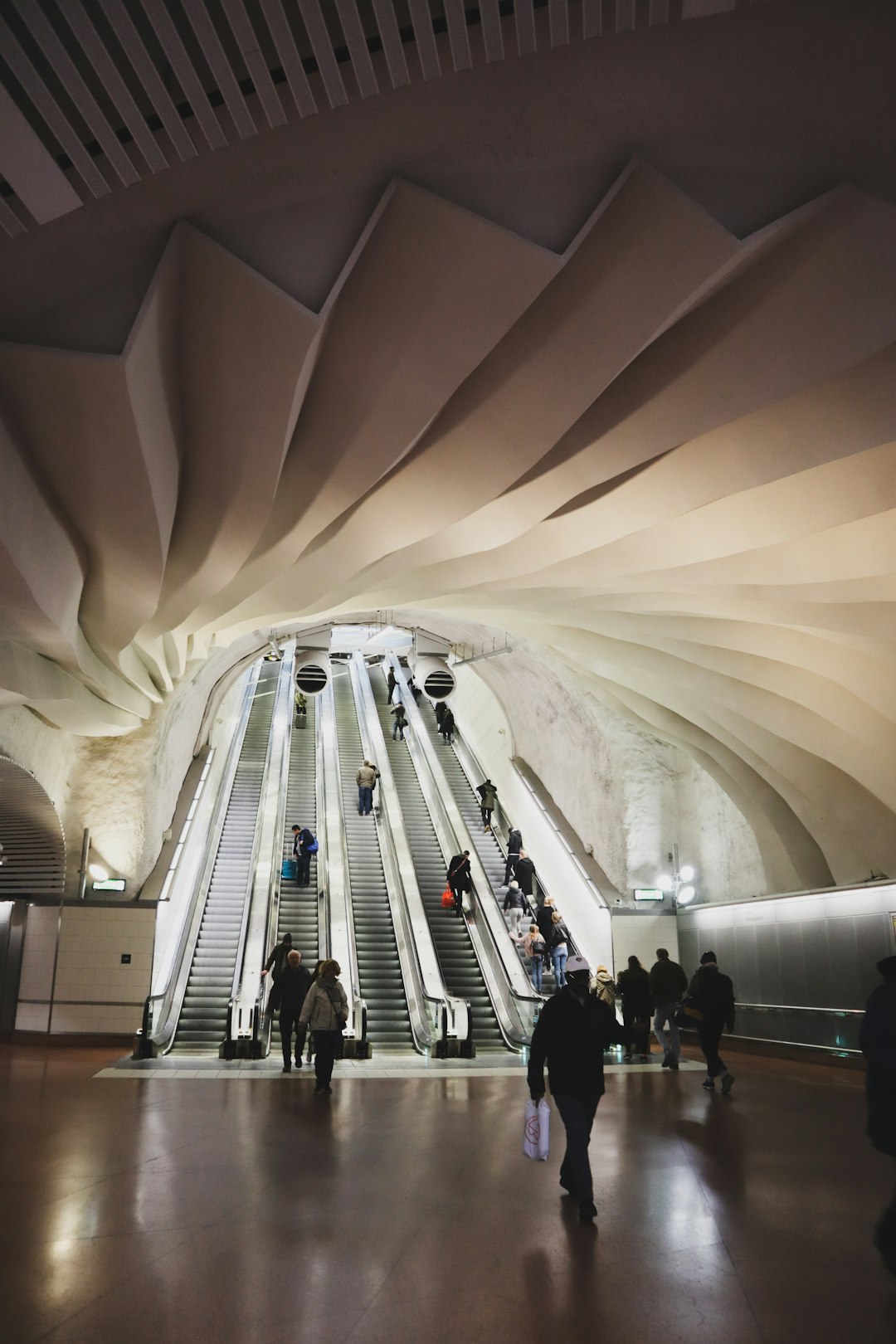 people walking near escalator